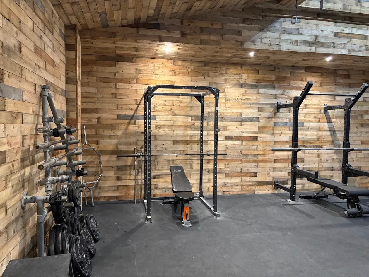 The squat rack and free weights in the training area