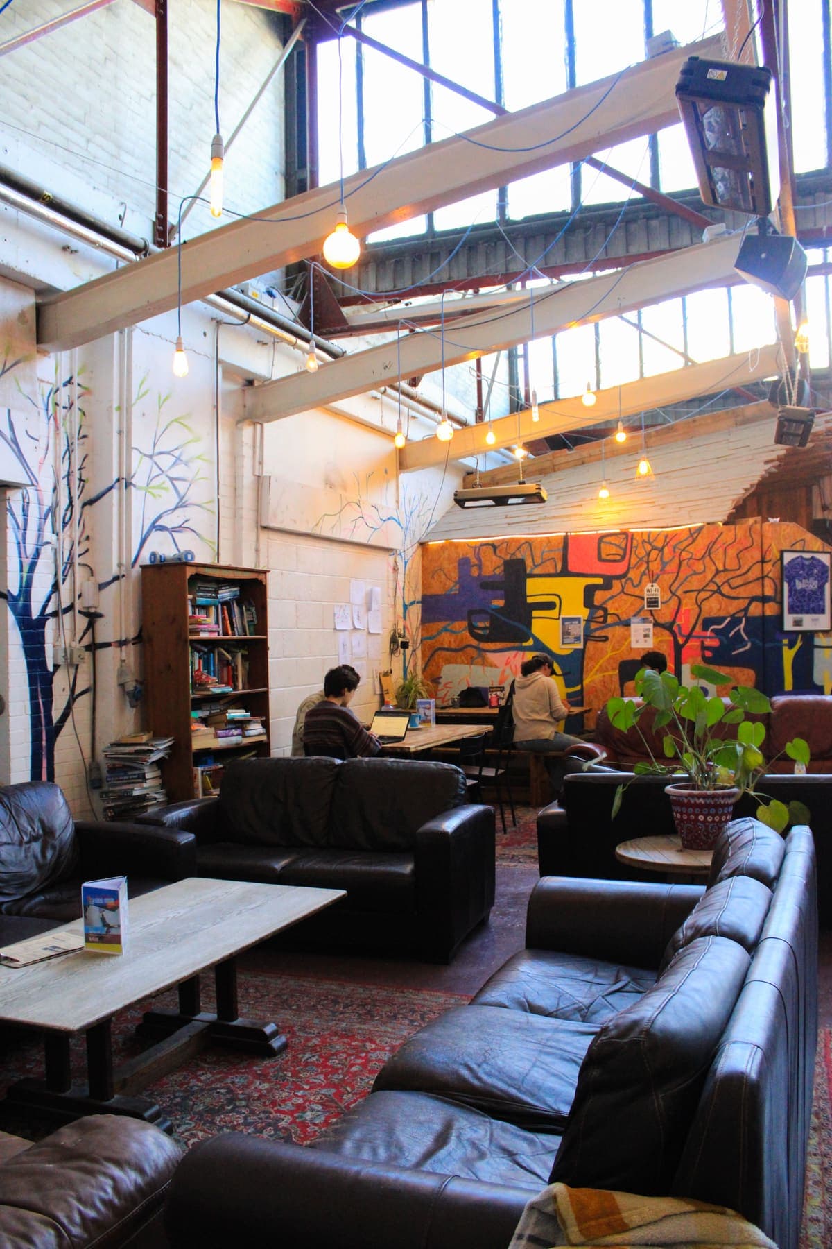 The café, with its sofas and tables under the roof lights