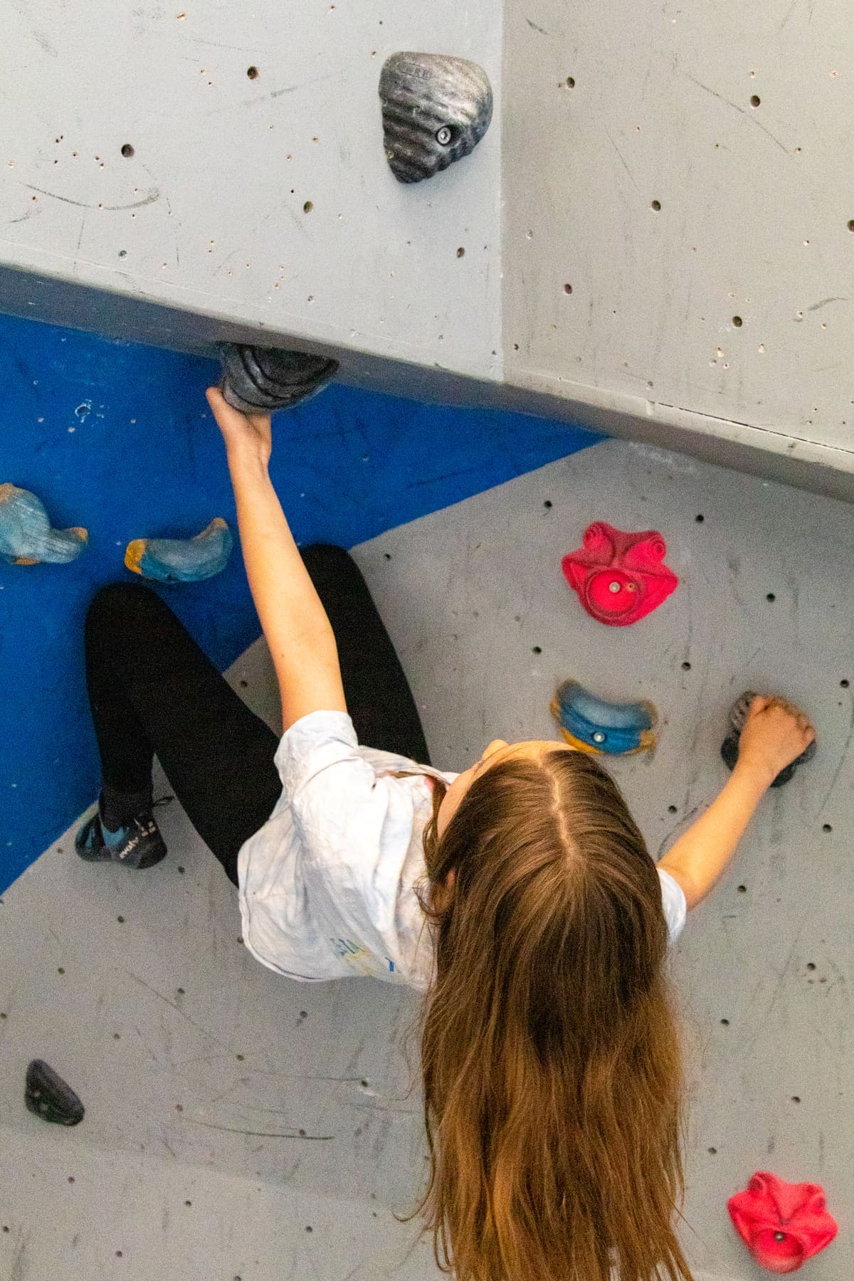 A girl climbing, seen from above